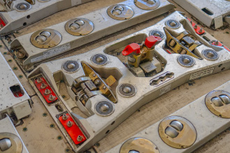 Lock: Restraint to hold a ULD in place